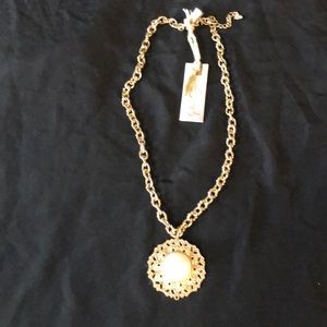 This necklace is gold new with tags